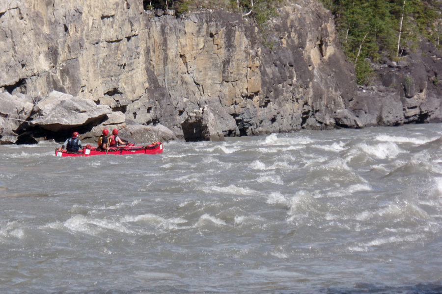 Paddling whitewater rapids on the Nahanni River in Nahanni National Park Preserve.