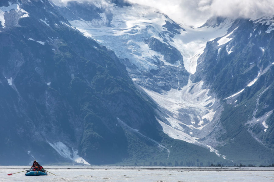 Rafters on the Tatshenshini River with a glacier in the background.