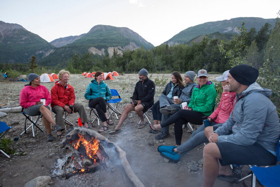 Rafters enjoying an evening campfire after a day of rafting the Tatshenshini River.