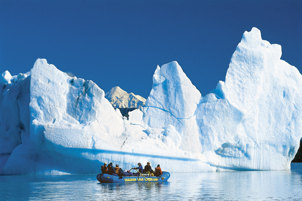 Rafting by Alsek Glacier where the icebergs are the small apartment buildings. Glacier Bay National Park, Alaska.