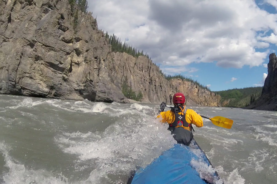 Paddling through rapids on the Nahanni River in Nahanni National Park Preserve in Canada's Northwest Territories.