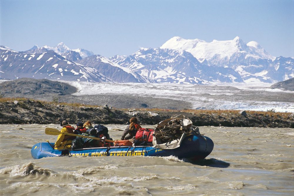Rafting through rapids on the Alsek River, which is renowned for large rapids, dramatic mountain valleys and glaciers