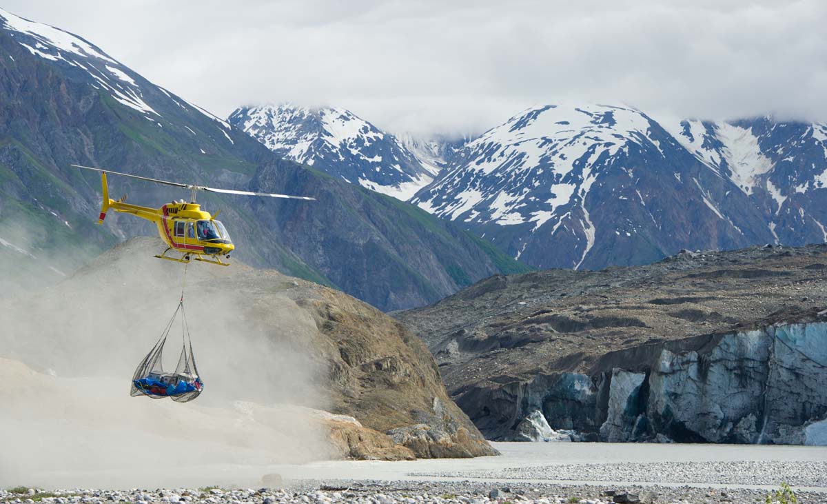 Helicopter is ready to go with a load of gear to portage from Tweedsmuir Glacier just to the end of Turnback Canyon. Tatshenshini Alsek Provincial Park, British Columbia. (Photo by Josh Miller)