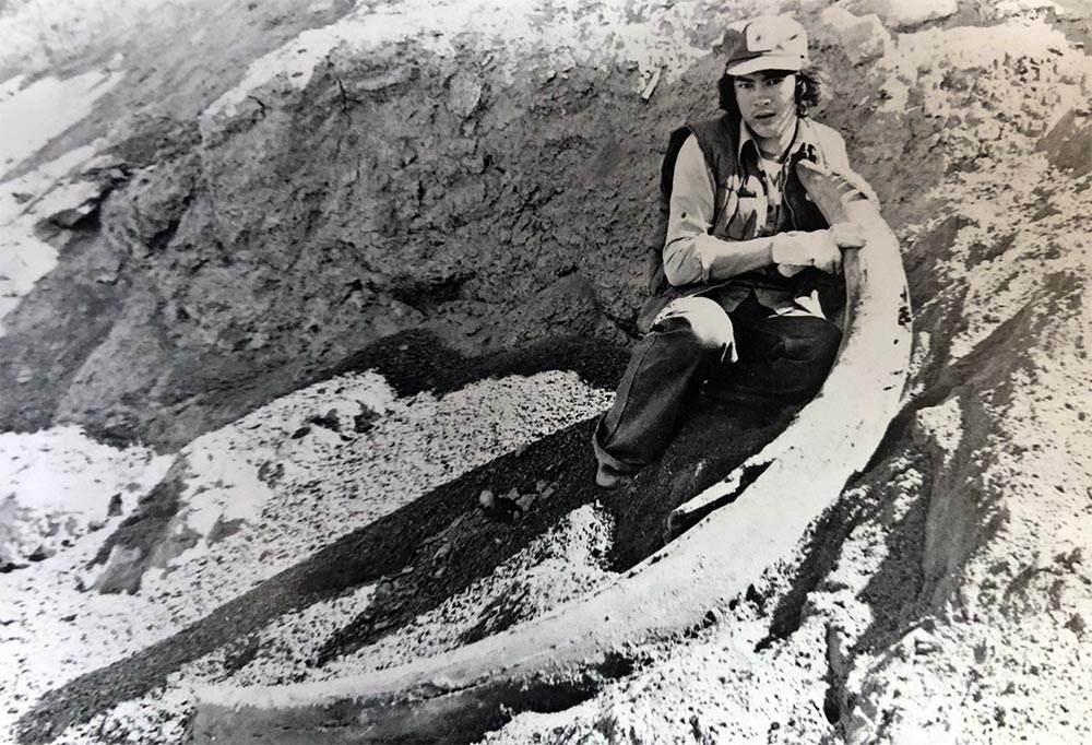 Old Crow resident Danny Kassi near Old Crow with a Mammoth Tusk, 1979.