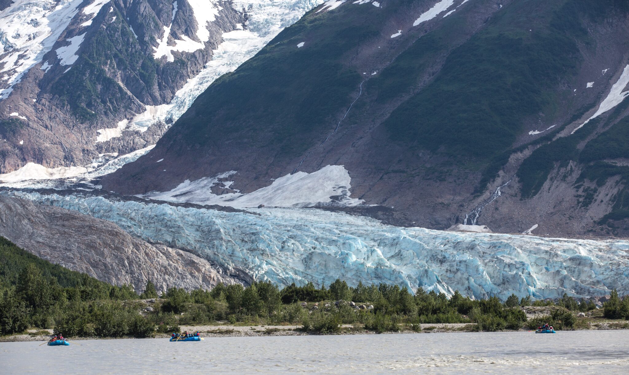 Rafters float past Walker Glacier, Glacier Bay National Park, Alaska.