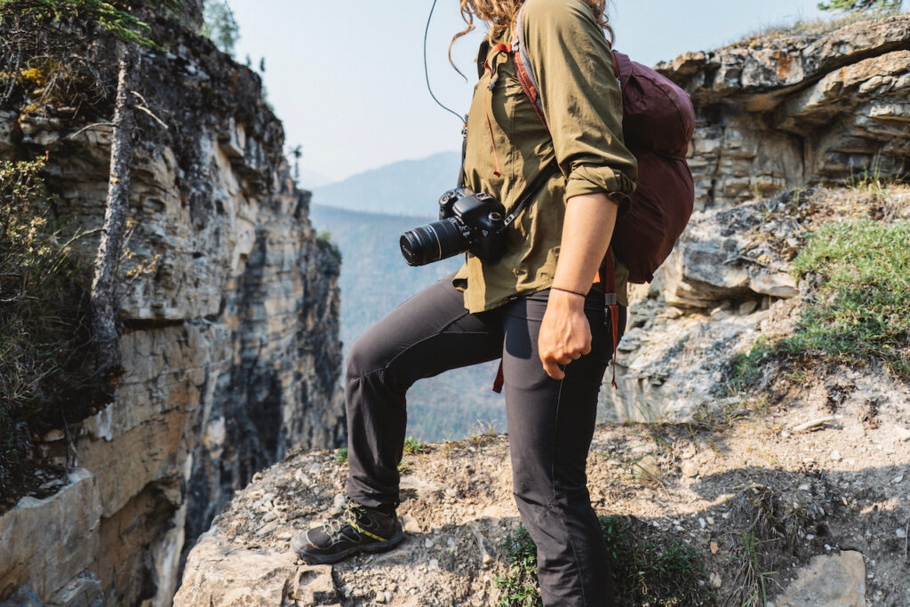 A hiker with a camera, Nahanni River, NWT, Canada.