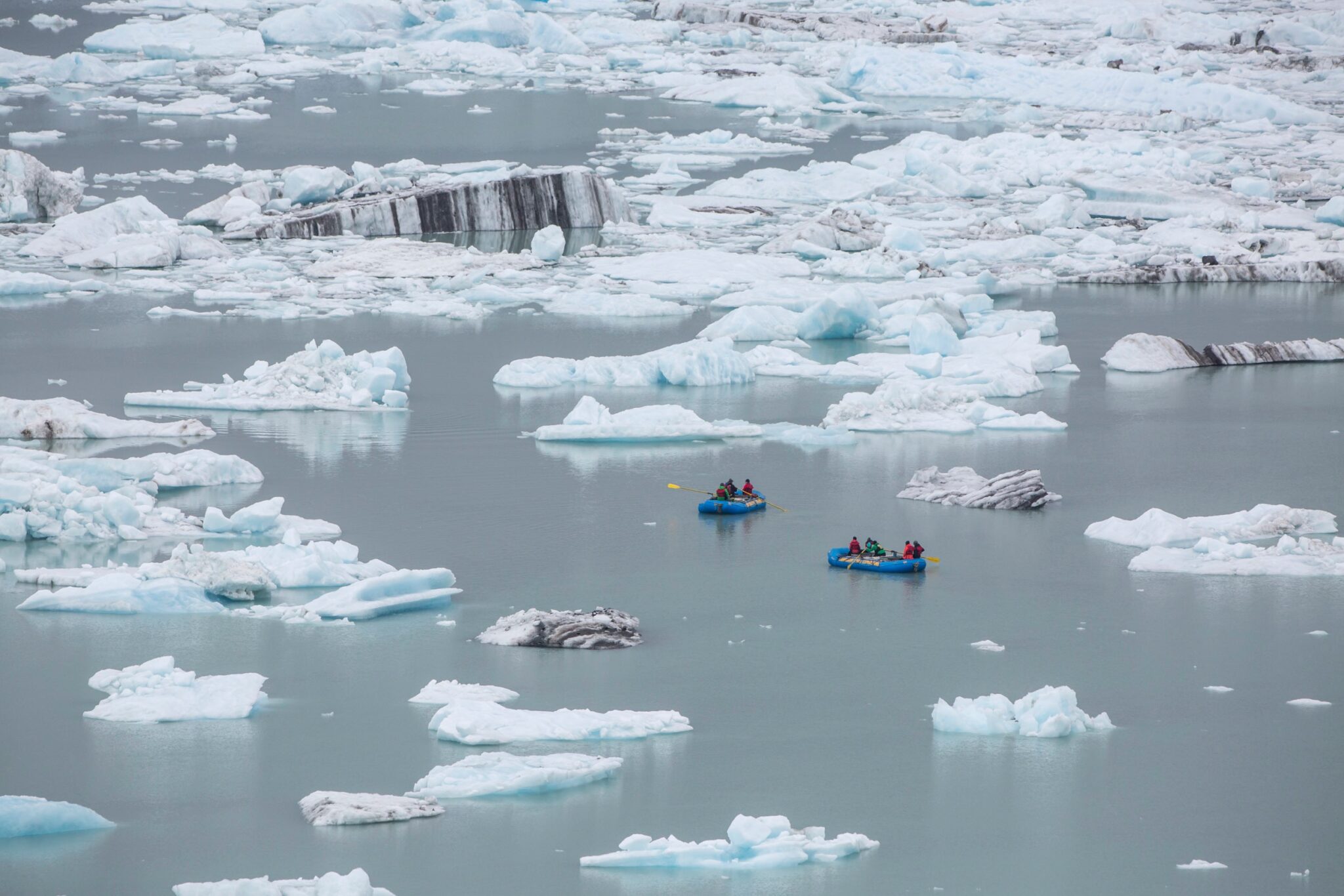 Rafters float among ice bergs at Alsek Lake, Glacier Bay National Park, Alaska.