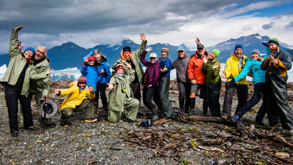 Rafters in rain gear on Alsek Lake, Alaska.